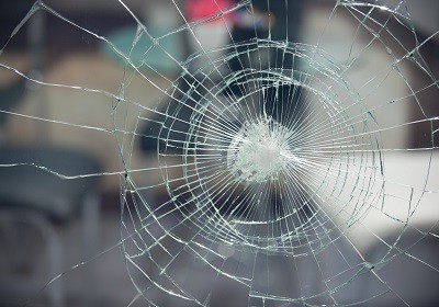 cracked window protected by safety and security window film